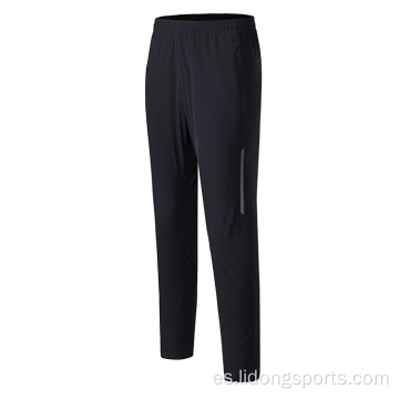 Pantalones de pista de corredera de entrenamiento sincero y seco